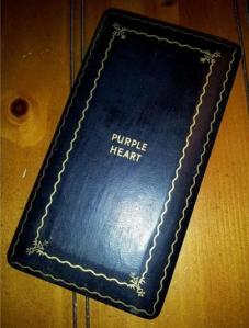 Affectionately known as a “coffin case,” this presentation box is inscribed with the name of the medal in gold leaf.