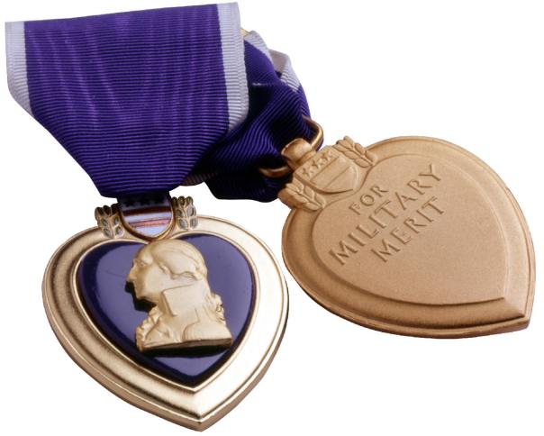 The Purple Heart Medal has been awarded since 1932 to veterans who were wounded or killed in action in WWI through the current conflicts. Showing the reverse of the PHM with the words, “For Military Merit” and the space beneath where it is traditionally engraved.