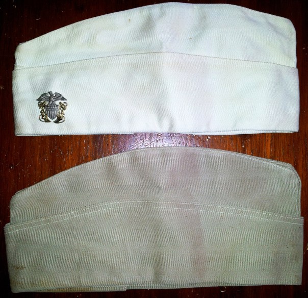 A Garrison Comparison: at the top is the white garrison (compared with a WWII khaki) demonstrating that, though it is yellowed, it is the rare white cap.