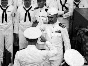 This shot shows Captain George C. Dyer departing the Astoria wearing his dress white uniform and the white garrison cover (source: Brent Jones Collection).