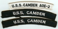 The two blue UIM patches shown are authorized by Navy uniform regulations. The white patch on top is a manufacturing mistake and unauthorized for wear on a Navy uniform. The USS Camden was decommissioned in 2005.