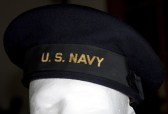 This post-1941 Navy flat hat shows the generic “U.S. Navy” tally. By 1960, these hats were retired from use.