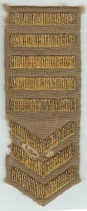 This patch was in my uncle’s possessions but the moth-eaten condition and that it is for a khaki uniform, makes it unsuitable for my display.