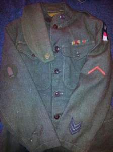 An overview of the uniform (and overseas cap) that I have recreated to represent my uncle's WWI service. Note the artillery shell insignia on the right sleeve is that of a First Class Gunner.