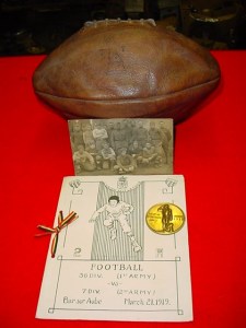 A fellow collector’s AEF football memorabilia - a program – 36th Division (1st Army) vs 7th Division (2nd Army) March 21, 1919; a football from a game between the 77th Division vs 81st Division teams; Football Championship Coin | First Prize – 86th Division.(source: Mark McCaffrey – Falls Creek Military Collectibles)
