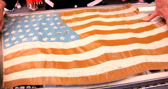 This flag looks to have been cut from a WWI American aircraft. The jury is still out as to whose aircraft it was removed from (source: Pawn Stars screen grab).