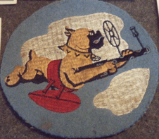 I have only found one single reference to the insignia that is painted onto the ballcap's bill. It is taken from the unit's squadron patch. This patch was part of a small group that included a photo and sold at auction for nearly $720.00 in 2014. (source: eBay image).