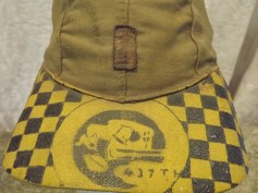 A close-up of the hand-painted bill shows the “437th” in the squadron insignia (source: eBay Image).