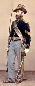 This uniform, though an immediate post-Civil War-issue, is clearly that of a sergeant in the U.S. Cavalry as noted by the gold chevrons (hand-tinted in the photo).
